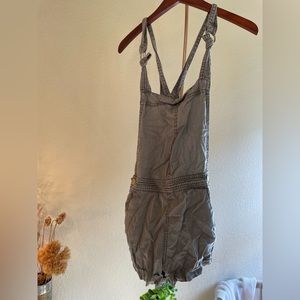 Green overall shorts.